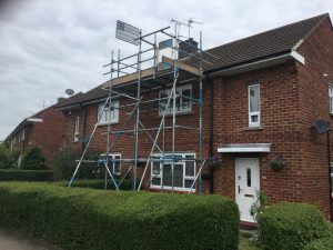 scaffolding on the front of a semi detached house - image 2