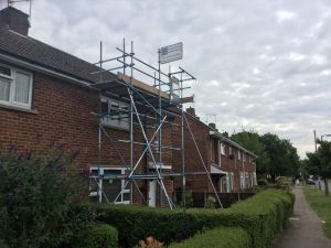 scaffolding on the front of a semi detached house