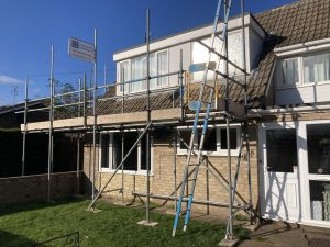 Bungalow with scaffolding equipment on the front - image 3