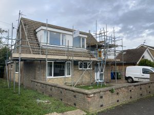 Bungalow with scaffolding equipment on the front - image 2